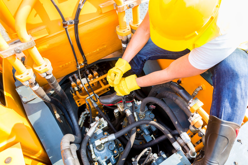 Mechanic servicing an engine